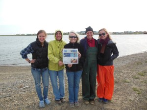 The Port Aransas crew pose with the Island Moon, the local Port A newspaper